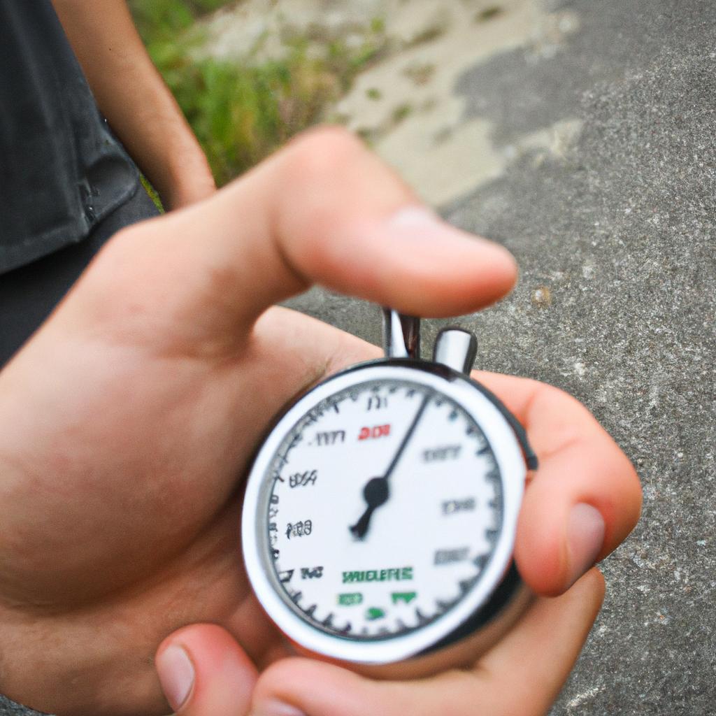 Person measuring speed with stopwatch